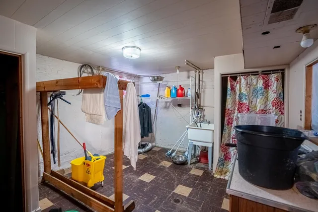 a room with furniture and utility room