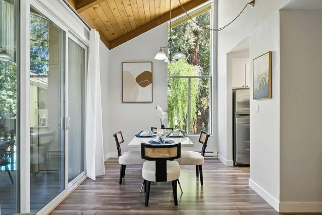 a view of a dining room with furniture and window