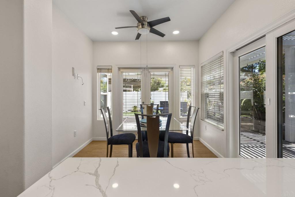 4939 Tilos Way Oceanside, CA 92056 - Photo 18 of 49 a view of a dining room with furniture and front door