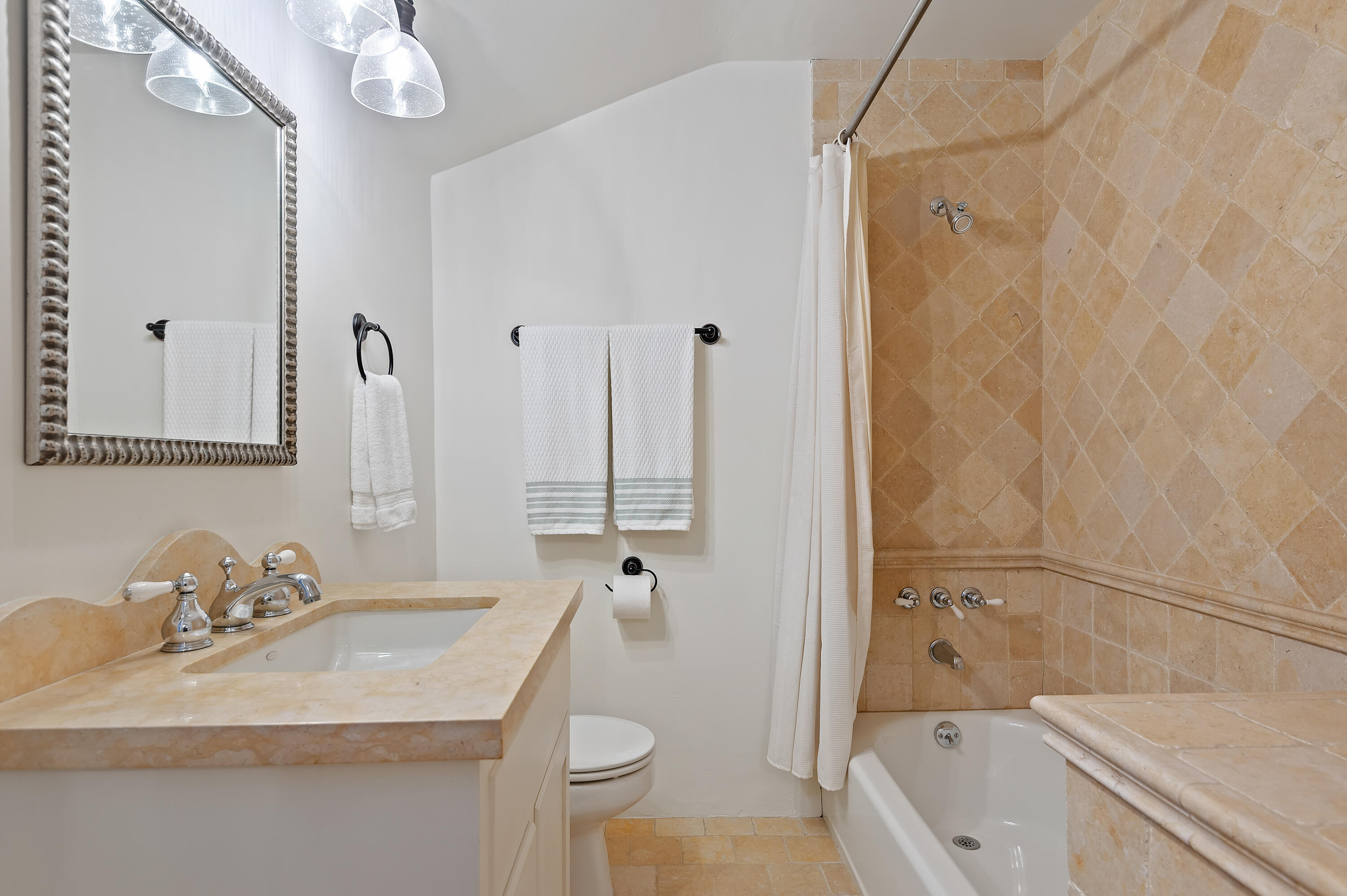 189 Hermosillo Road Montecito, CA 93108 - Photo 23 of 47 a bathroom with a granite countertop sink a toilet and shower