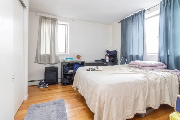 a bed room with a bed and a window