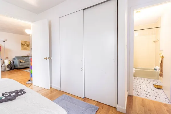 a bedroom with a bed and a view of bedroom