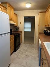 908 Cross Bend Road Plano, TX 75023 - Photo 9 of 11 a kitchen with a refrigerator stove and sink