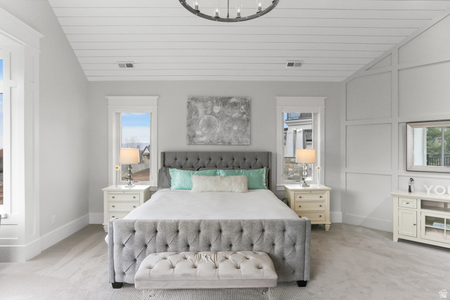 1354 South 800 East Mapleton, UT 84664 - Photo 35 of 129 Bedroom with light carpet, suspended lighting, a decorative wall, and a vaulted wood ceiling