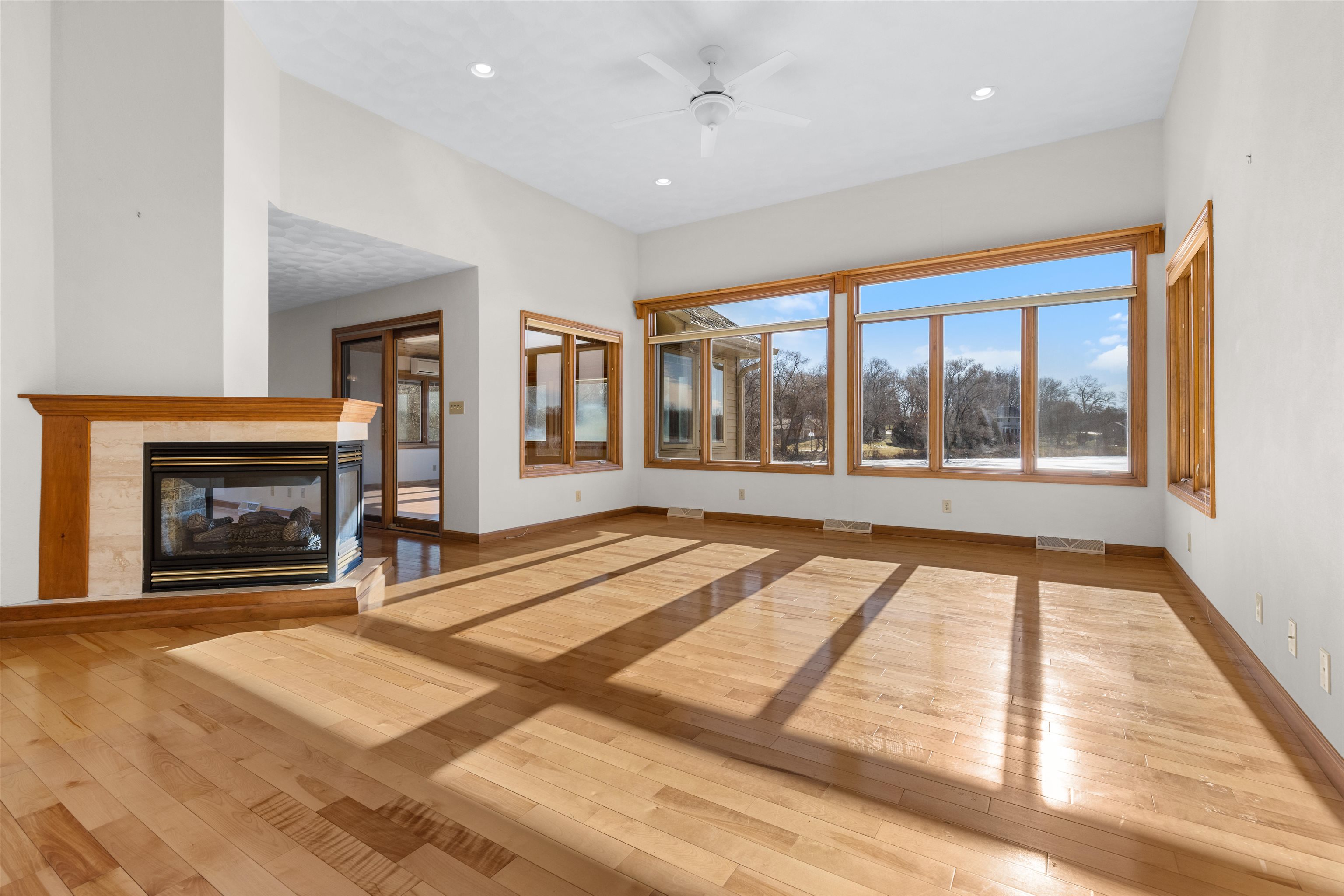 8317 Snaresbrook Road Roscoe, IL 61073 - Photo 29 of 45 a view of an empty room with a fireplace and a window