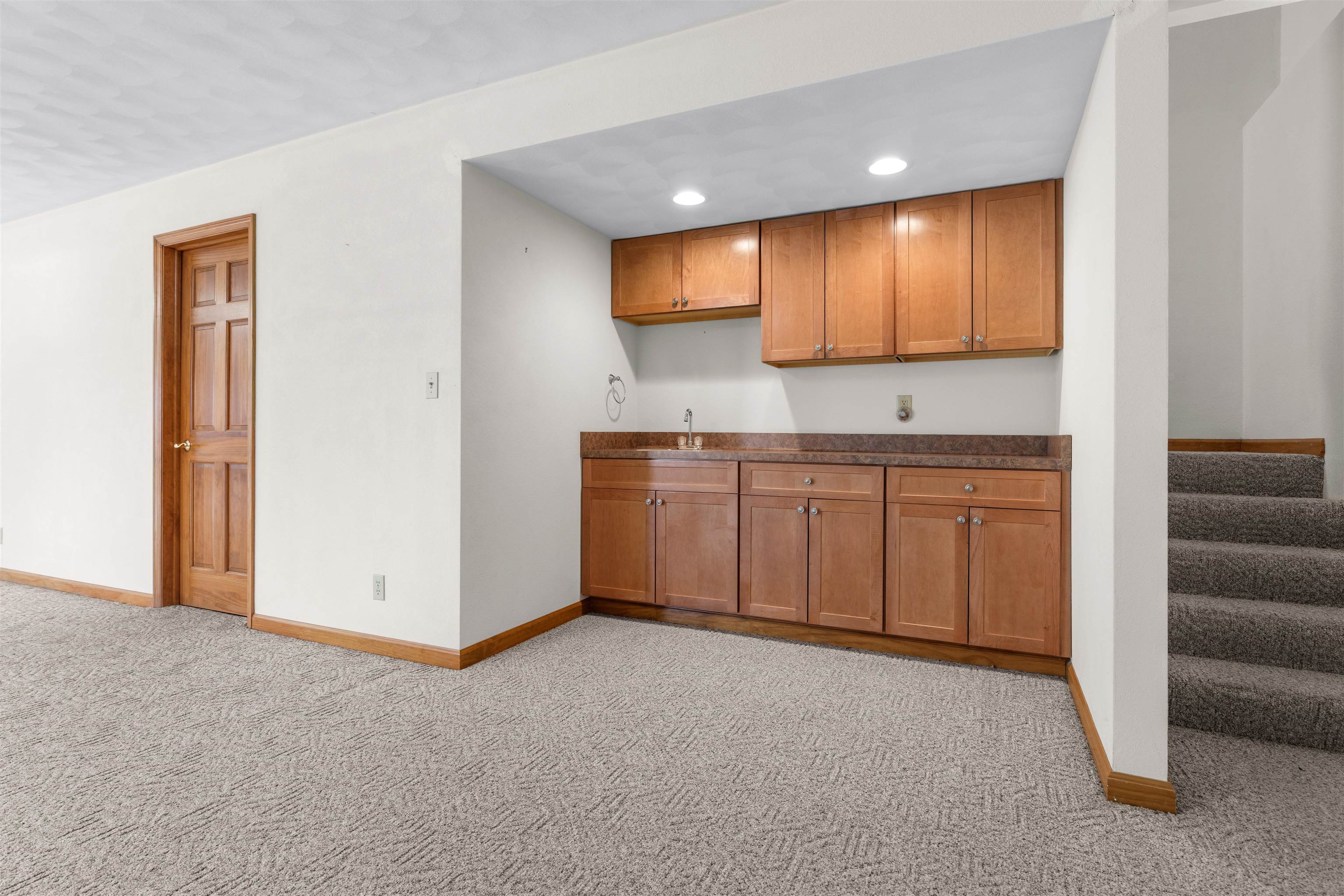 8317 Snaresbrook Road Roscoe, IL 61073 - Photo 33 of 45 a view of a kitchen with a sink and a refrigerator