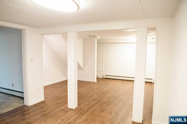 134 Berkshire Road Hasbrouck Heights, NJ 07604 - Photo 16 of 17 a view of a room with wooden floor