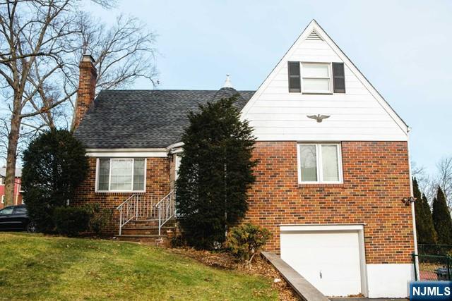 134 Berkshire Road Hasbrouck Heights, NJ 07604 - Photo 2 of 17 front view of house with a yard