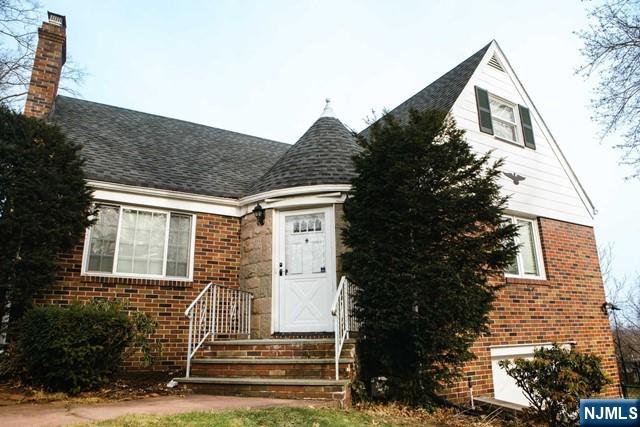 134 Berkshire Road Hasbrouck Heights, NJ 07604 - Photo 3 of 17 a front view of a house with a yard