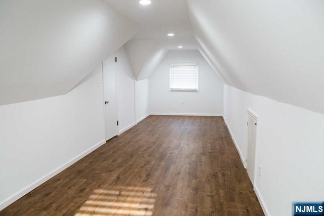134 Berkshire Road Hasbrouck Heights, NJ 07604 - Photo 10 of 17 wooden floor in an empty room with a window