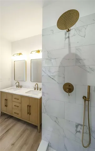a bathroom with a sink mirror and toilet