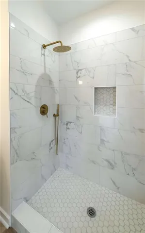 a bathroom with a sink double vanity and shower