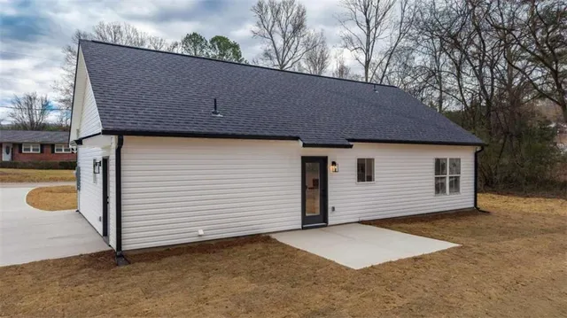 an aerial view of residential house with outdoor space