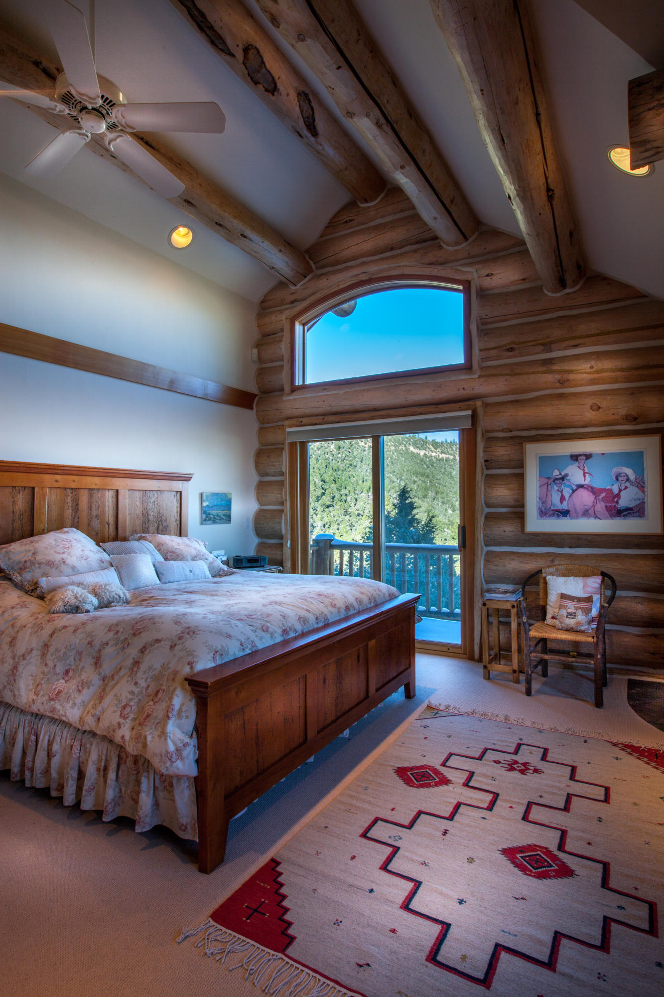2505 McClure Road Ridgway, CO 81432 - Photo 19 of 33 a bedroom with a bed and wooden floor