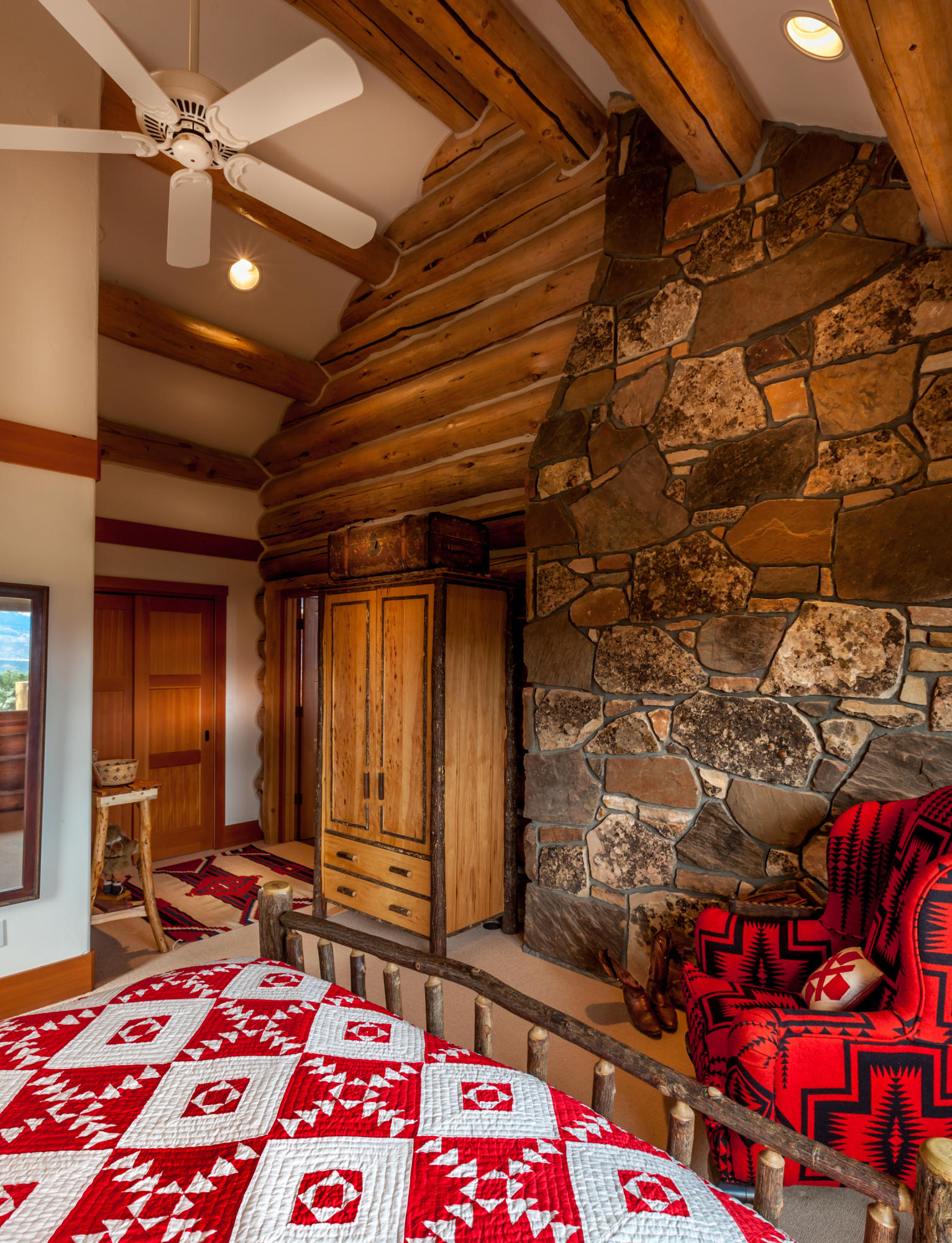 2505 McClure Road Ridgway, CO 81432 - Photo 22 of 33 a bedroom with a bed and a walk in closet