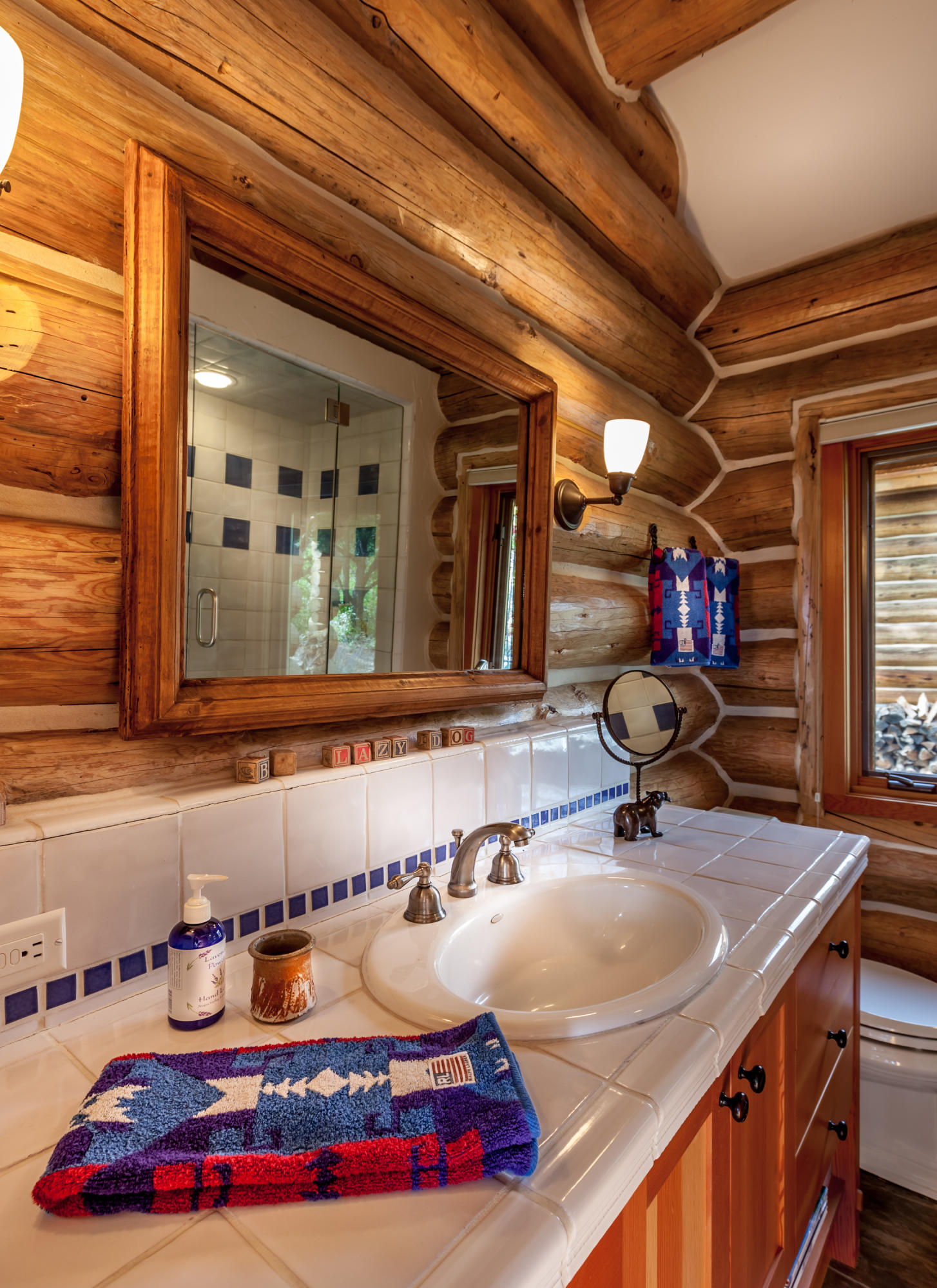 2505 McClure Road Ridgway, CO 81432 - Photo 23 of 33 a bathroom with a sink and a mirror