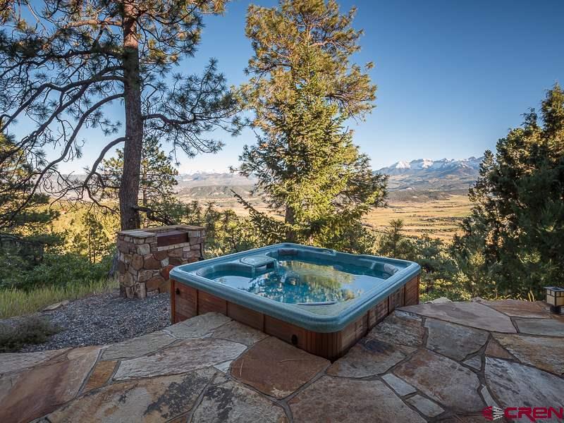 2505 McClure Road Ridgway, CO 81432 - Photo 7 of 33 a view of a backyard with plants and lake view
