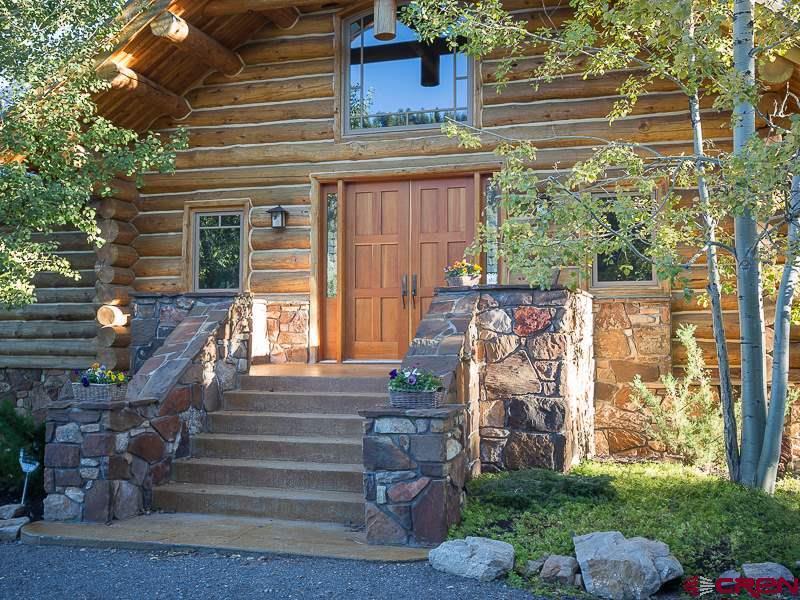 2505 McClure Road Ridgway, CO 81432 - Photo 8 of 33 a front view of a house with a garden