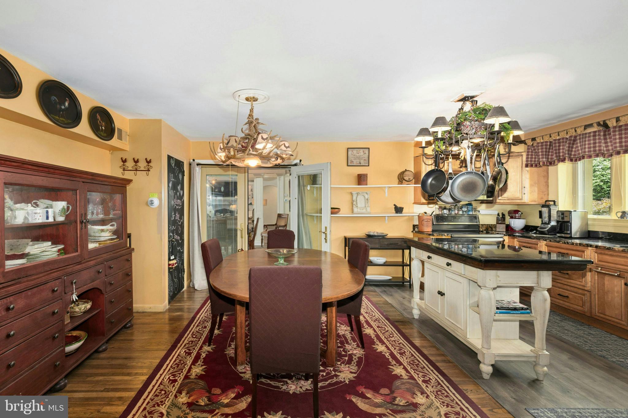 1305 Ridge Valley Road Sellersville, PA 18960 - Photo 35 of 59 a view of a dining room with furniture a chandelier and wooden floor