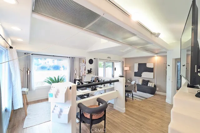 a large kitchen with a table and chairs