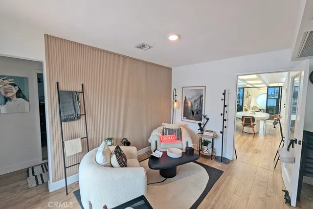 a view of living room with furniture and a fireplace