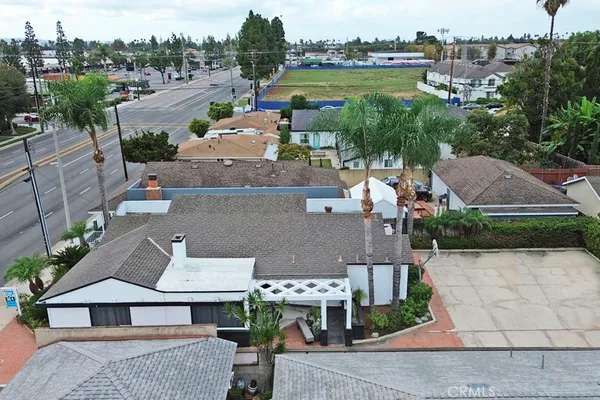 an aerial view of residential houses and street