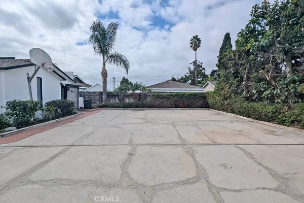 an aerial view of a house with a garden and yard