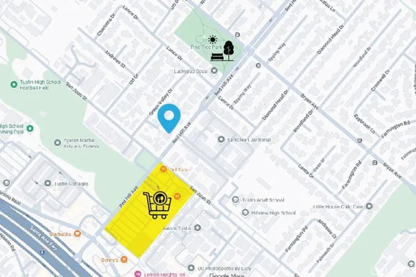 a living room with furniture a rug and a large window