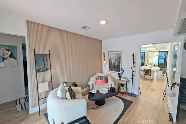 a living room with furniture and a rug