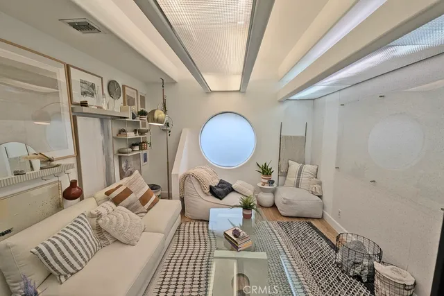 a bedroom with furniture and wooden floor