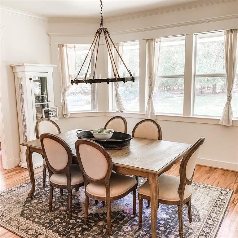 581 Country Club Road Fairview, TX 75069 - Photo 9 of 39 a table and chairs sitting in a room next to a window