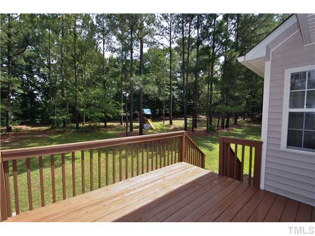 223 Ridge Drive Garner, NC 27529 - Photo 15 of 20 The wonderful back deck is a great and extremely private on this large wooded lot Patio/Deck