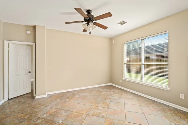 a view of an empty room with a window