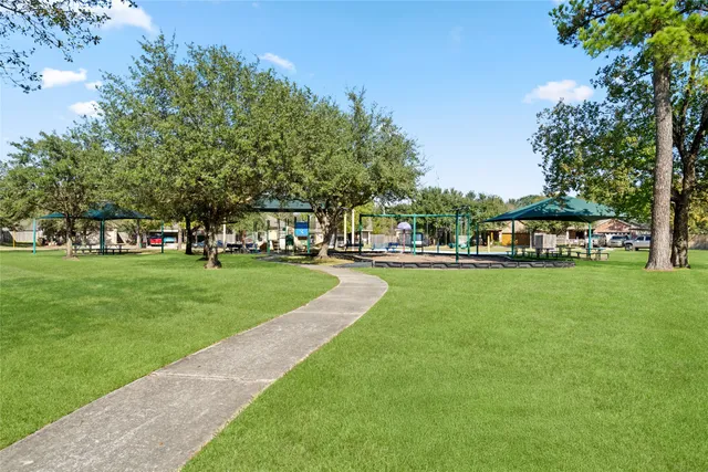 a view of outdoor space with garden and trees
