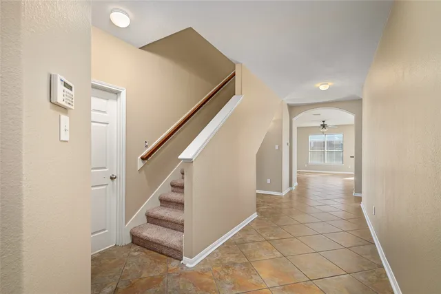 a view of a hallway with staircase