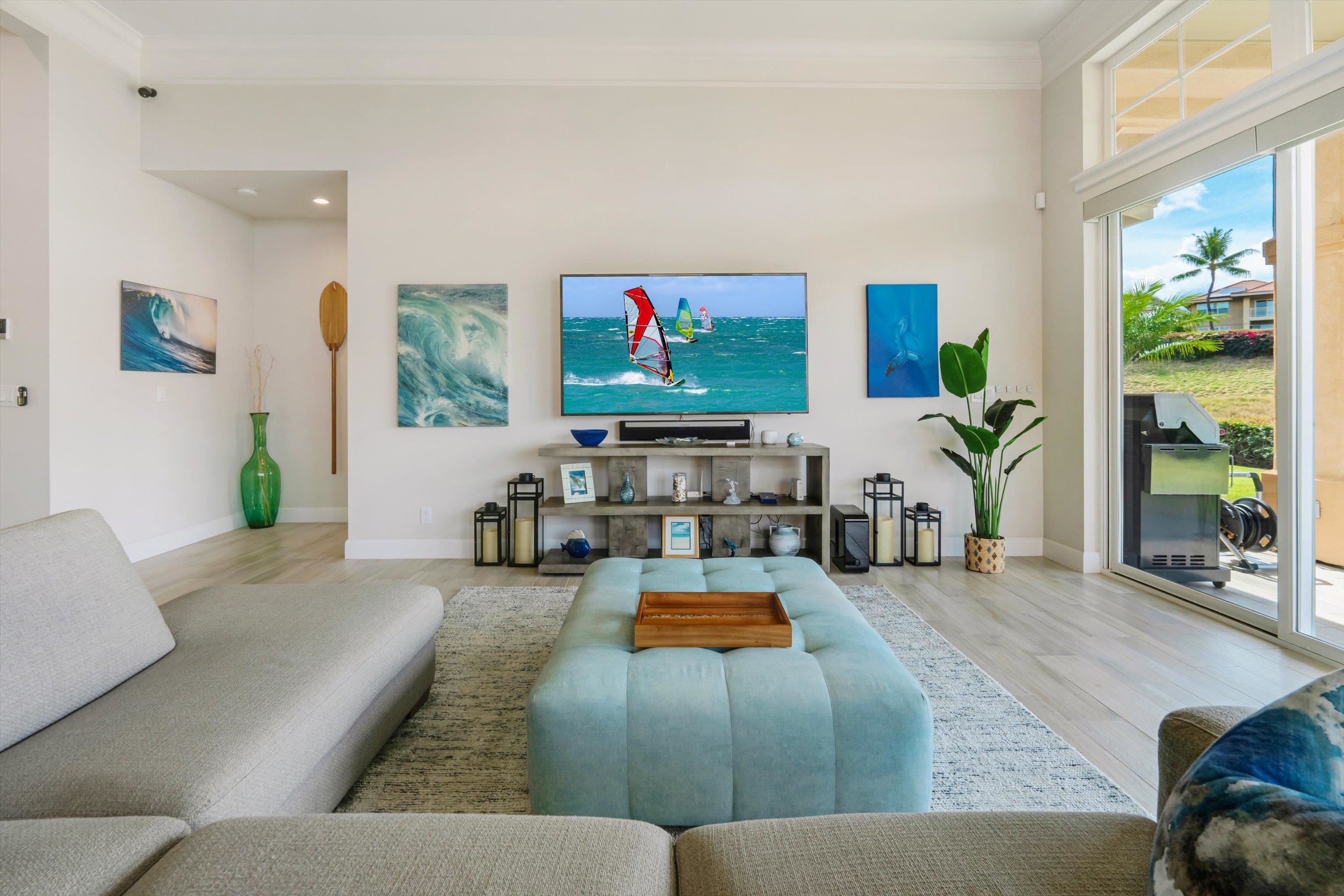 1323 Umeke Circle, Unit 102 Kihei, HI 96753 - Photo 20 of 50 a living room with furniture and a flat screen tv