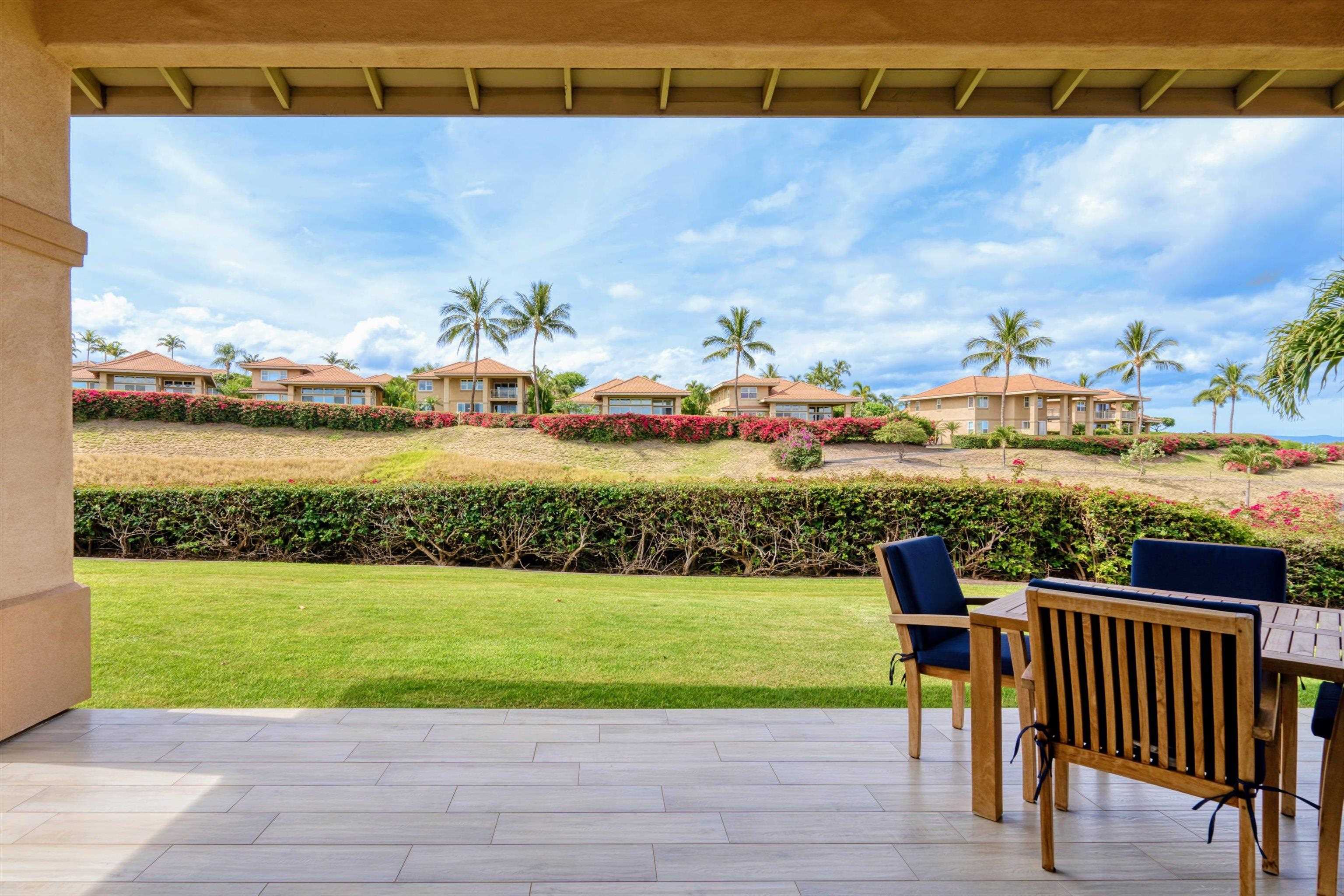 1323 Umeke Circle, Unit 102 Kihei, HI 96753 - Photo 23 of 50 a view of a terrace with a table and chairs