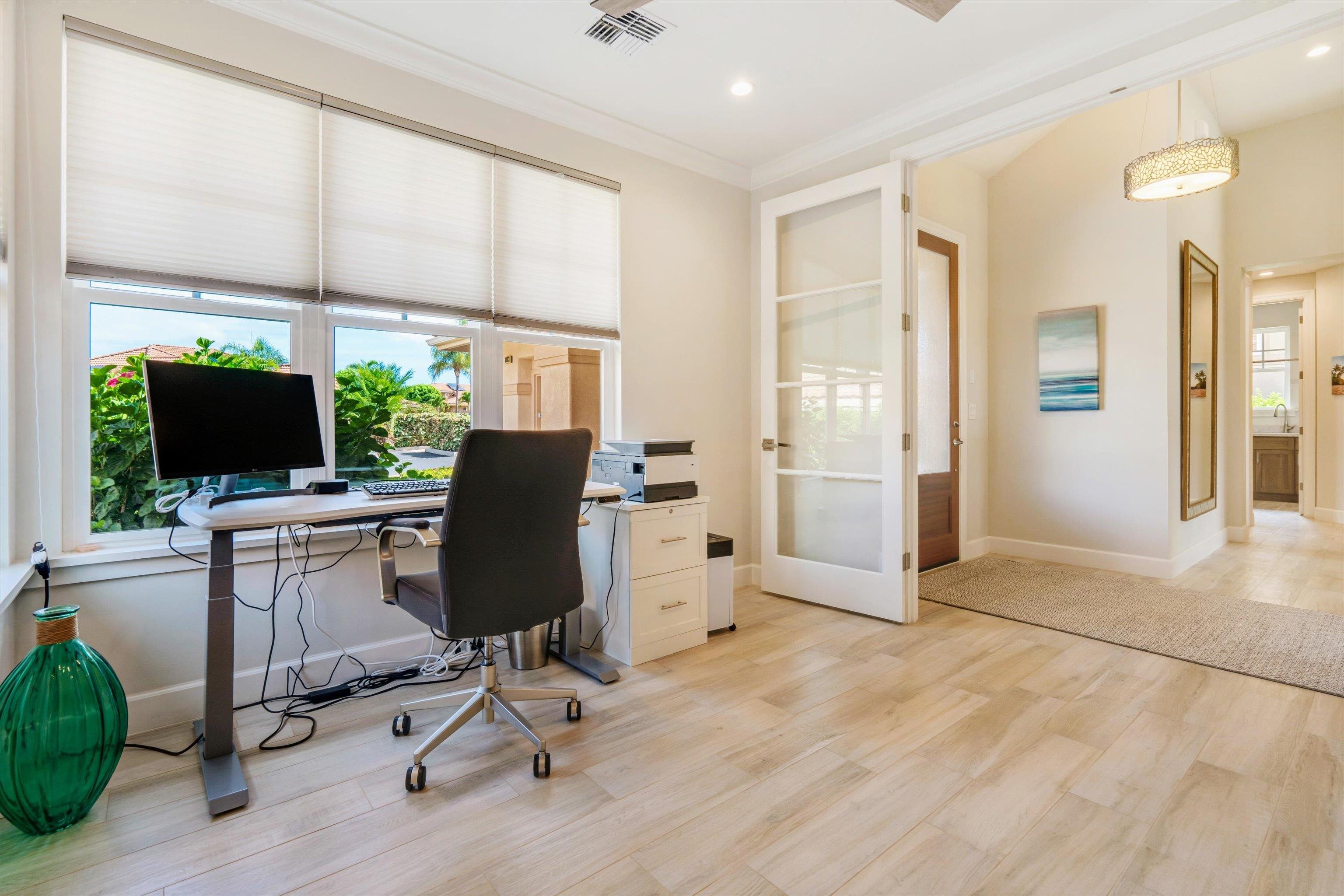 1323 Umeke Circle, Unit 102 Kihei, HI 96753 - Photo 25 of 50 a view of a workspace with furniture and a window