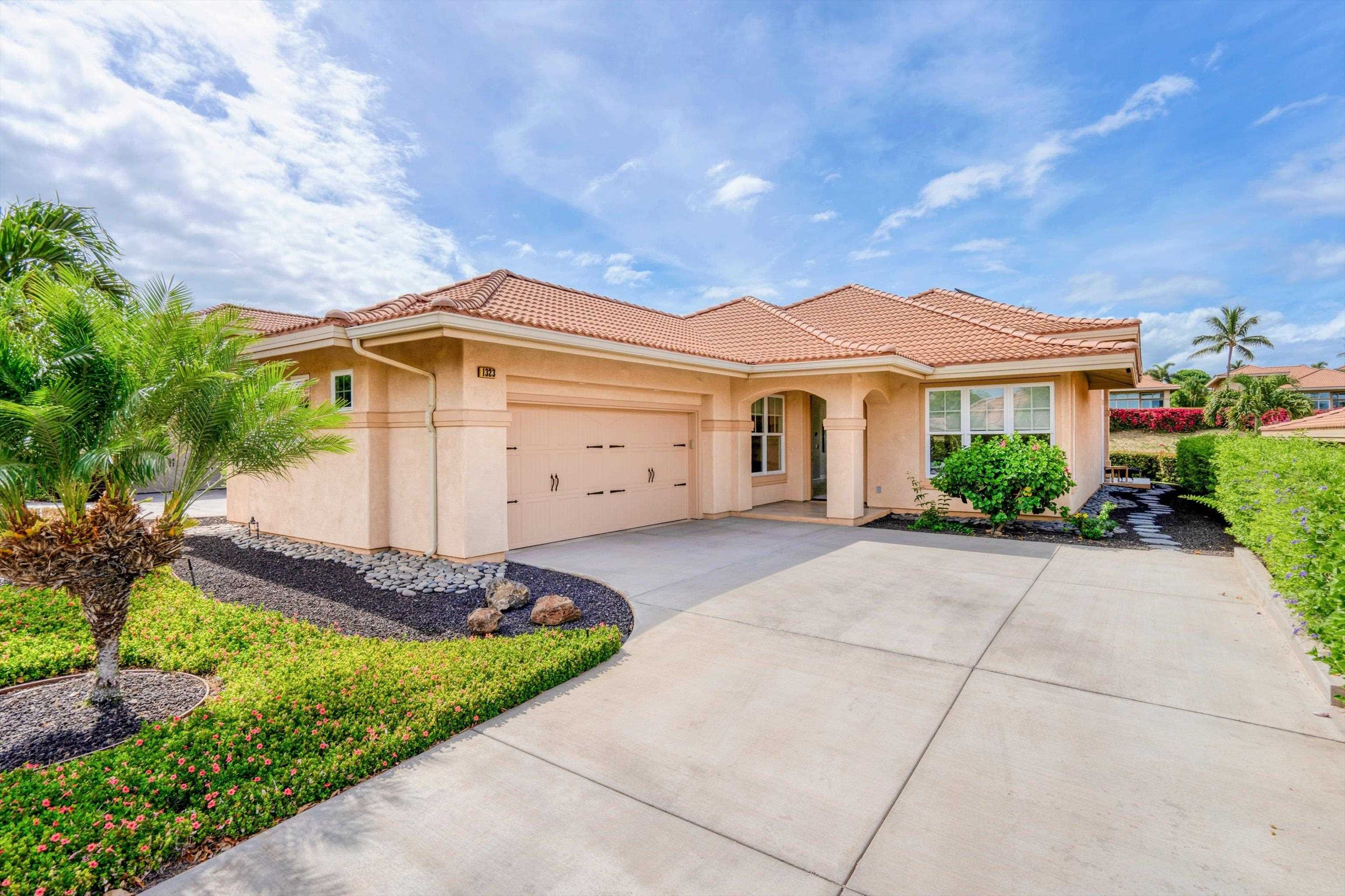 1323 Umeke Circle, Unit 102 Kihei, HI 96753 - Photo 30 of 50 a view of a house with a yard