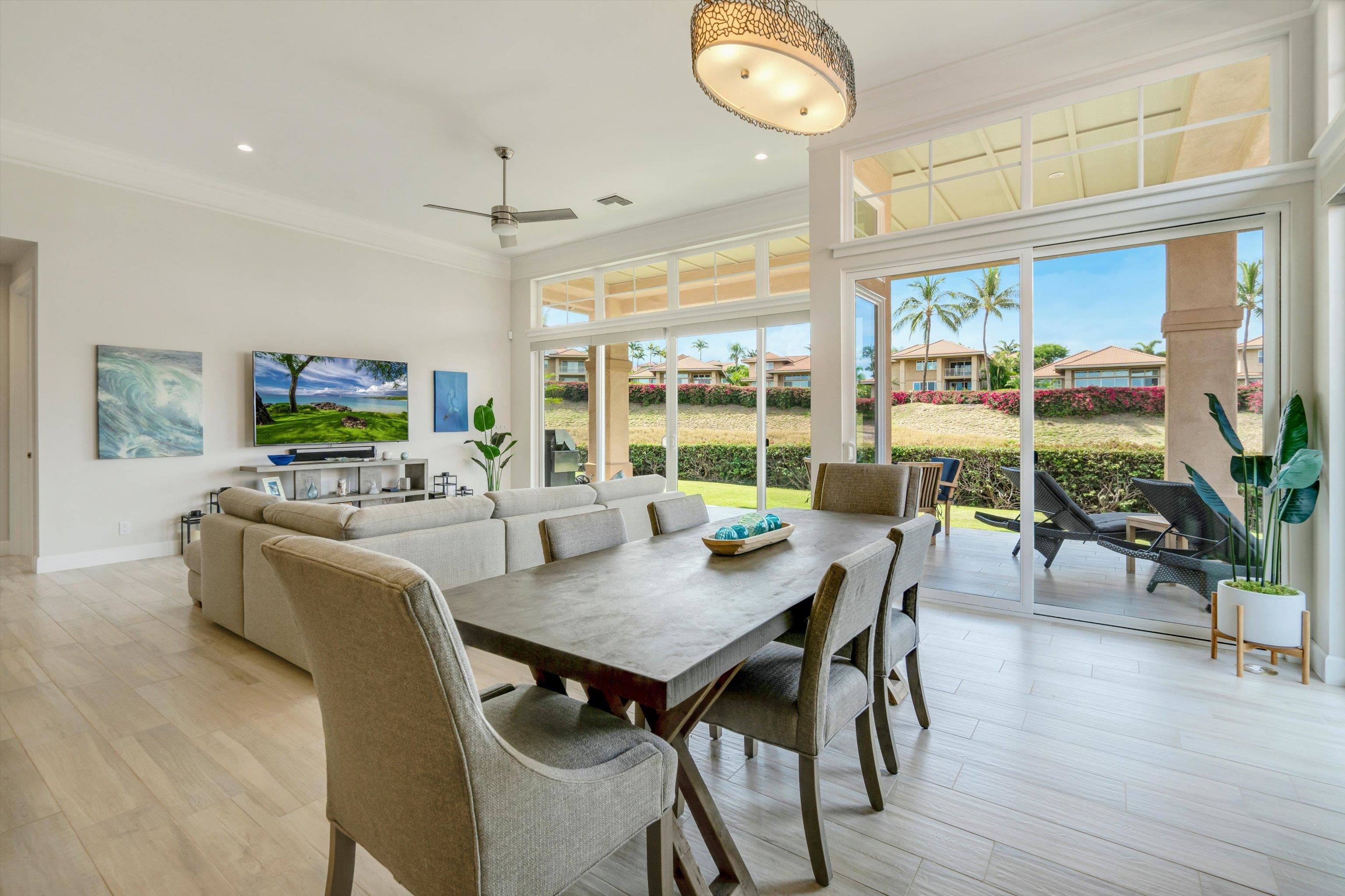 1323 Umeke Circle, Unit 102 Kihei, HI 96753 - Photo 3 of 50 a view of a dining room with furniture window and wooden floor