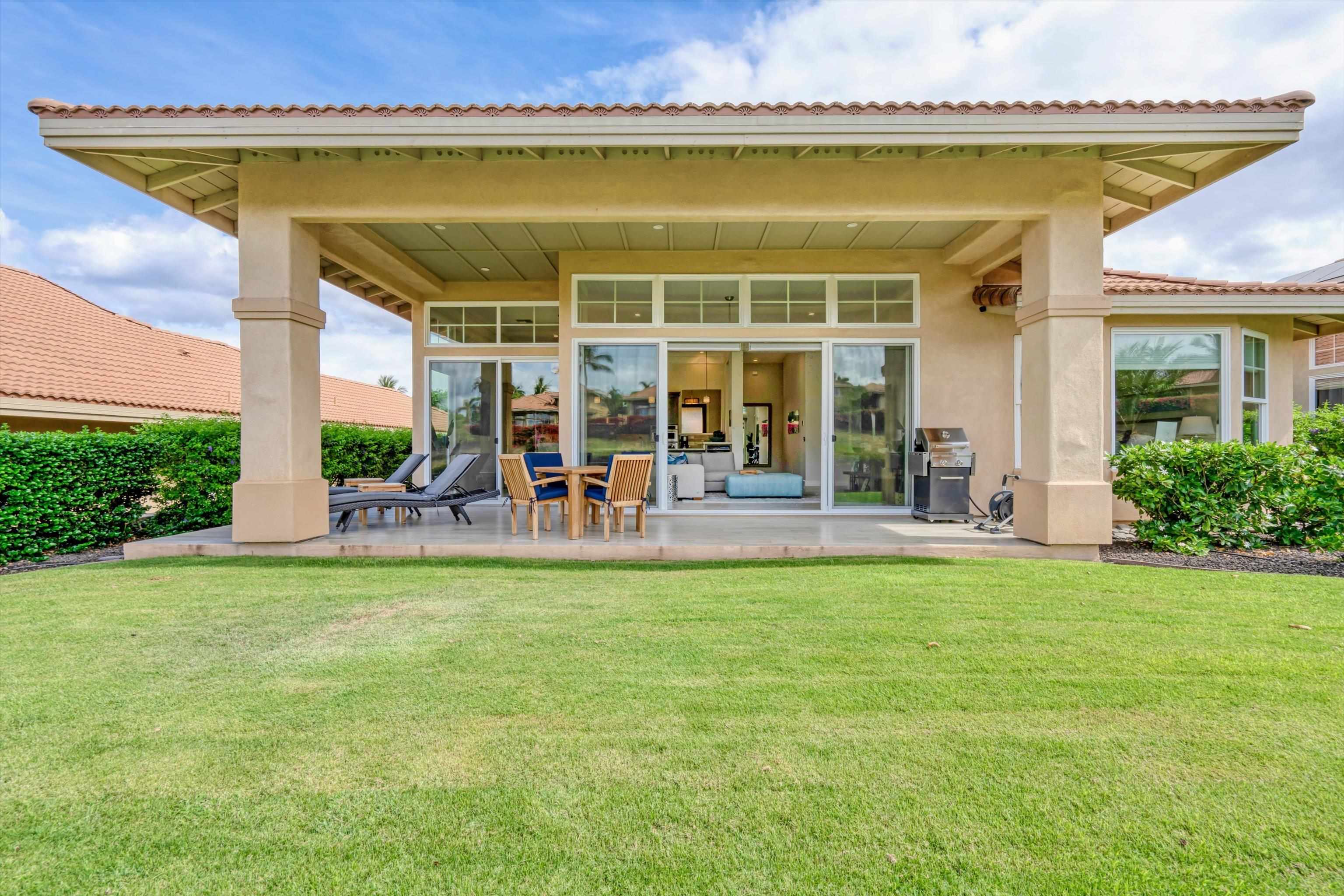 1323 Umeke Circle, Unit 102 Kihei, HI 96753 - Photo 32 of 50 a view of a swimming pool with outdoor seating