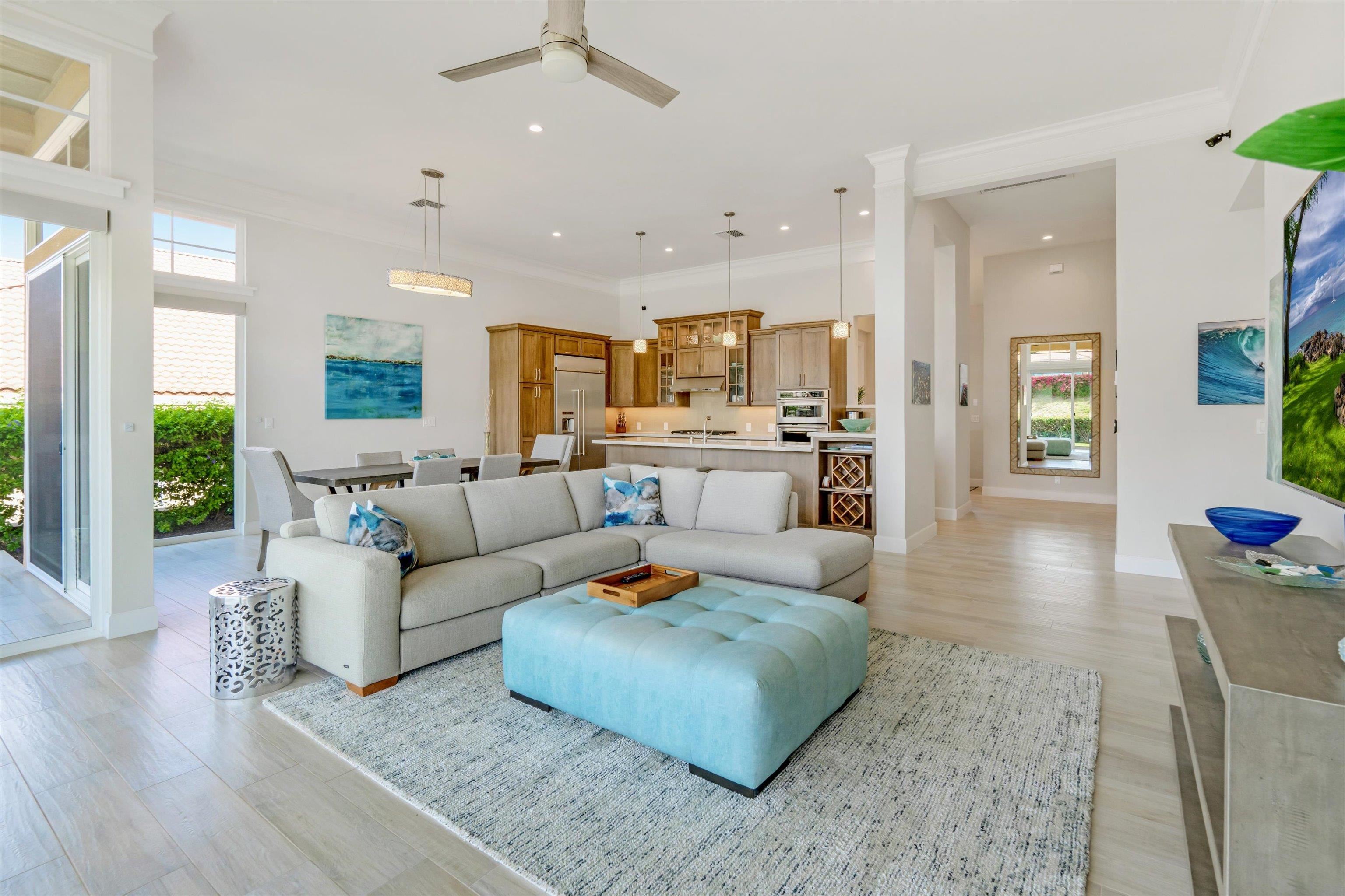 1323 Umeke Circle, Unit 102 Kihei, HI 96753 - Photo 7 of 50 a living room with furniture and a large window