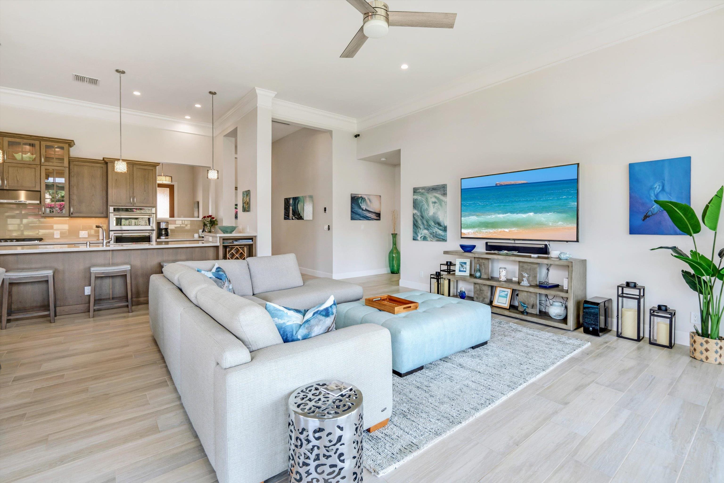 1323 Umeke Circle, Unit 102 Kihei, HI 96753 - Photo 10 of 50 a living room with furniture and a flat screen tv