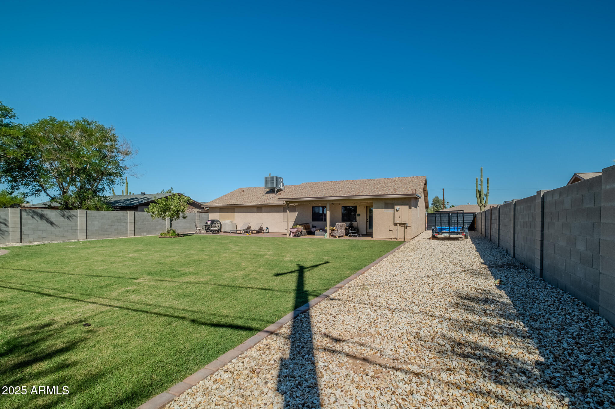 841 East Granada Avenue Apache Junction, AZ 85119 - Photo 11 of 33 a house with green field in front of it