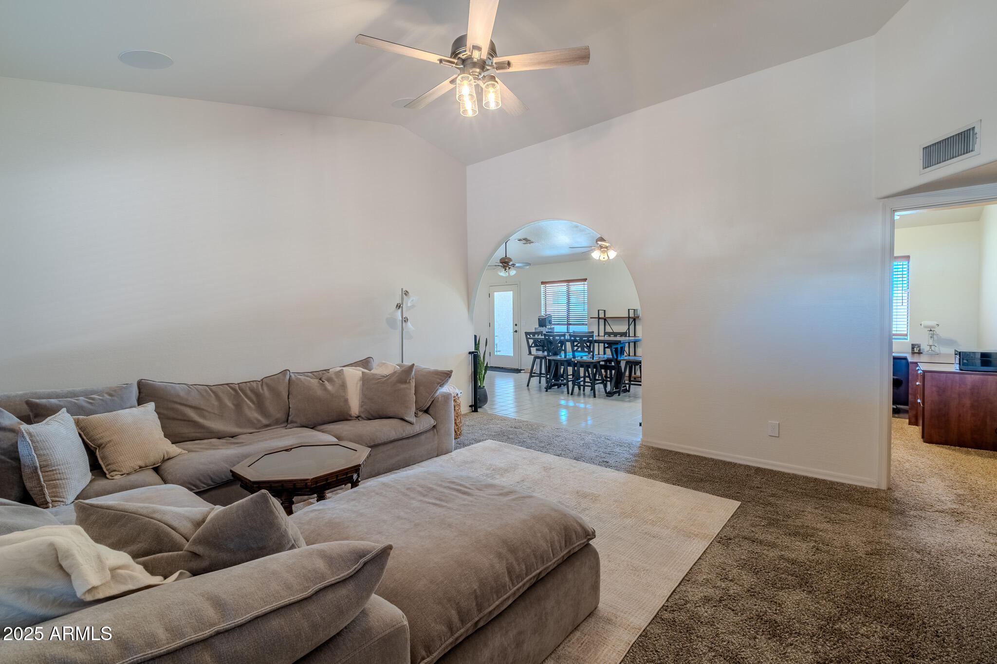 841 East Granada Avenue Apache Junction, AZ 85119 - Photo 13 of 33 a living room with furniture and a chandelier
