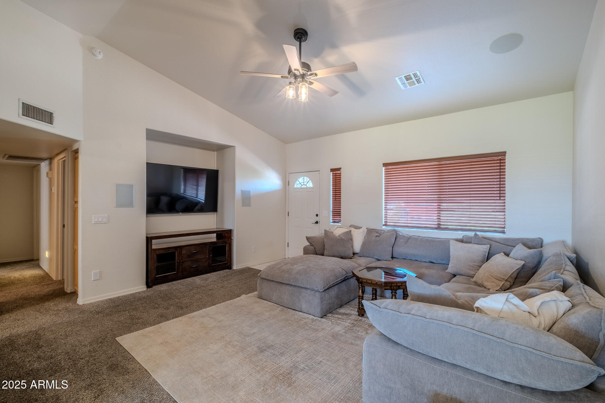841 East Granada Avenue Apache Junction, AZ 85119 - Photo 14 of 33 a living room with furniture and a flat screen tv
