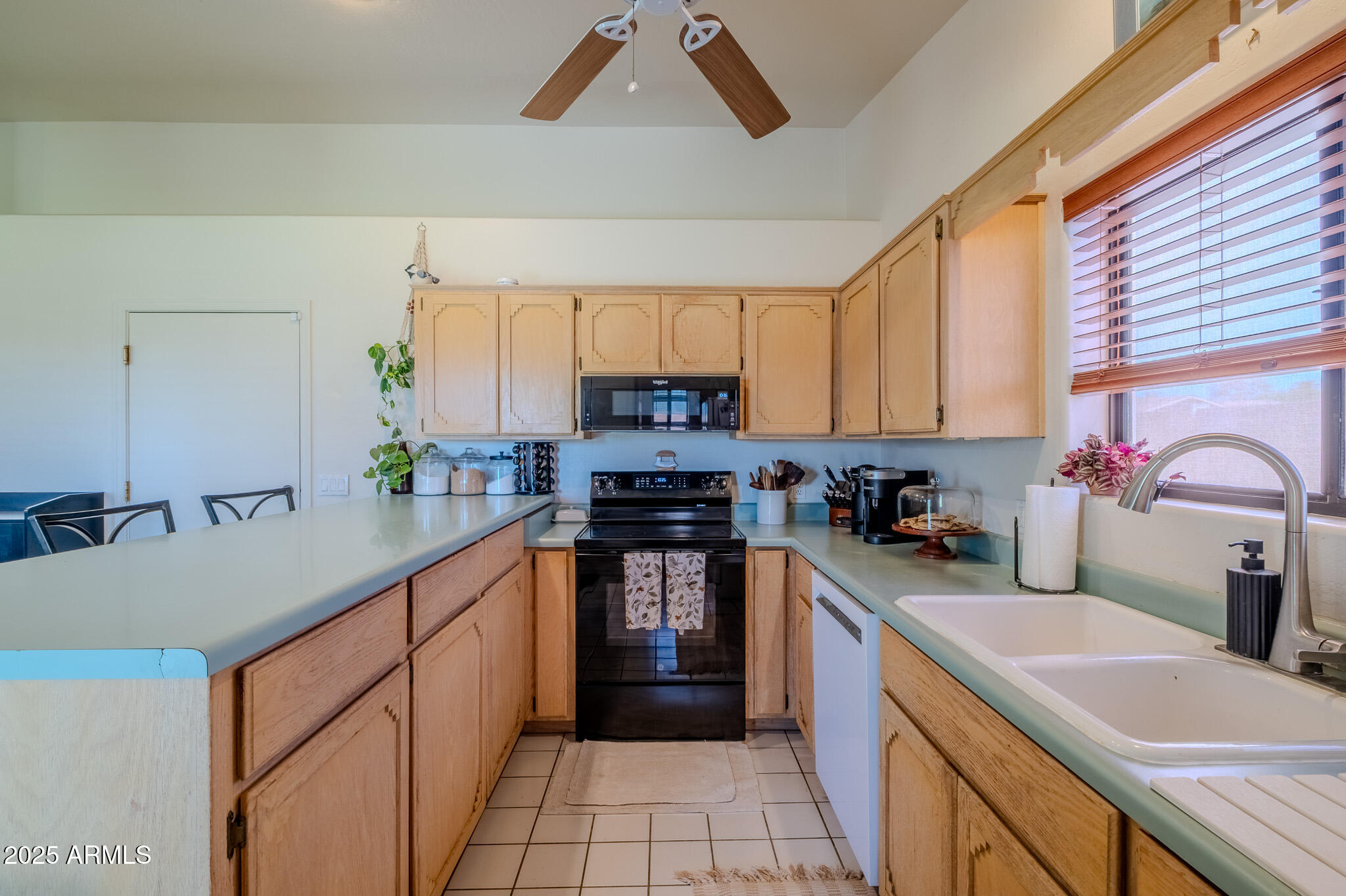 841 East Granada Avenue Apache Junction, AZ 85119 - Photo 17 of 33 a kitchen with a sink stove top oven and cabinets