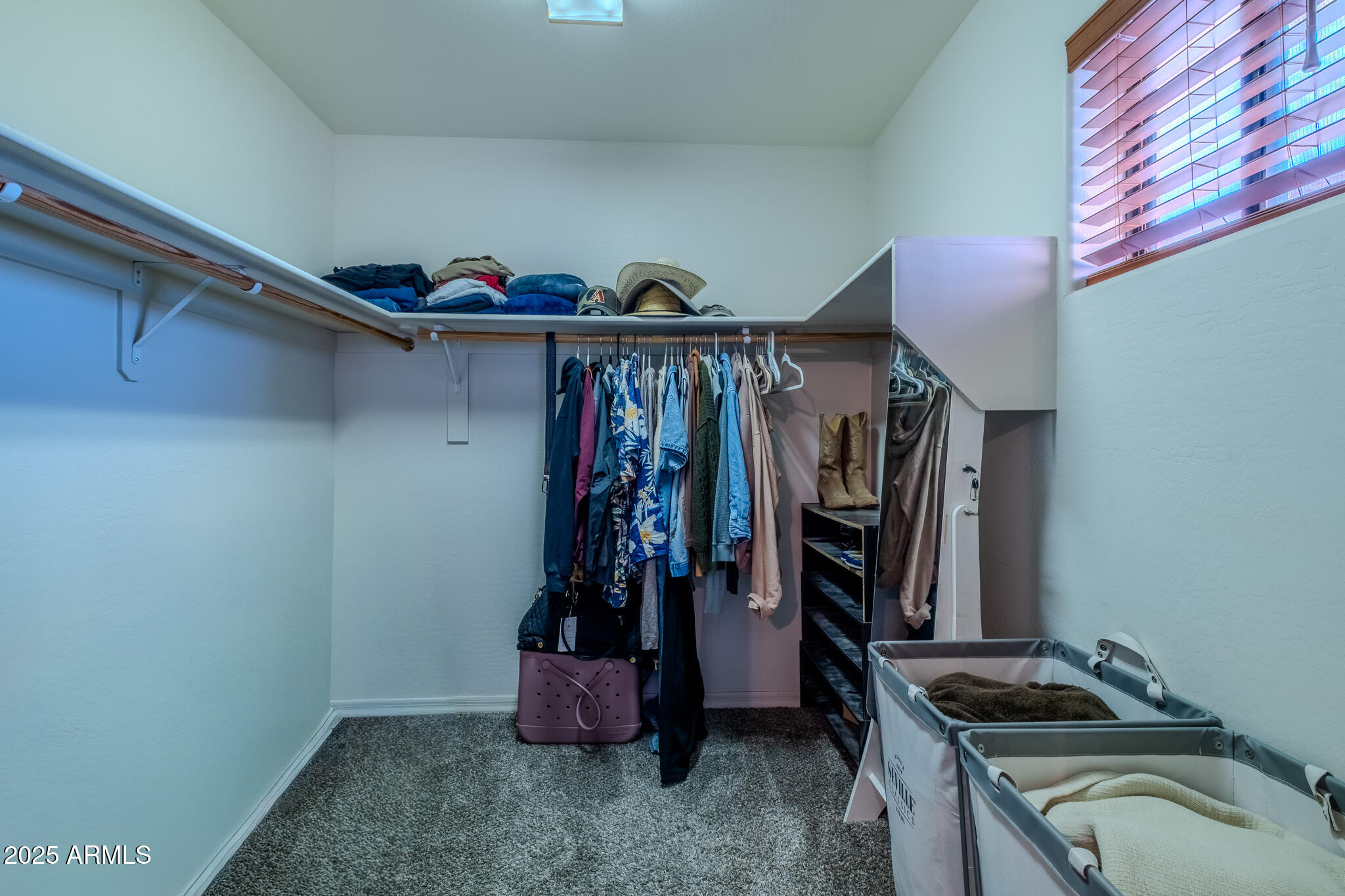 841 East Granada Avenue Apache Junction, AZ 85119 - Photo 20 of 33 a view of walk in closet with clothes and shoes