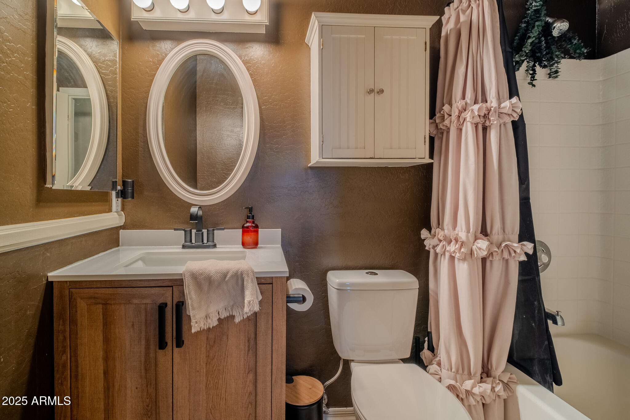 841 East Granada Avenue Apache Junction, AZ 85119 - Photo 25 of 33 a bathroom with a toilet a sink and a mirror