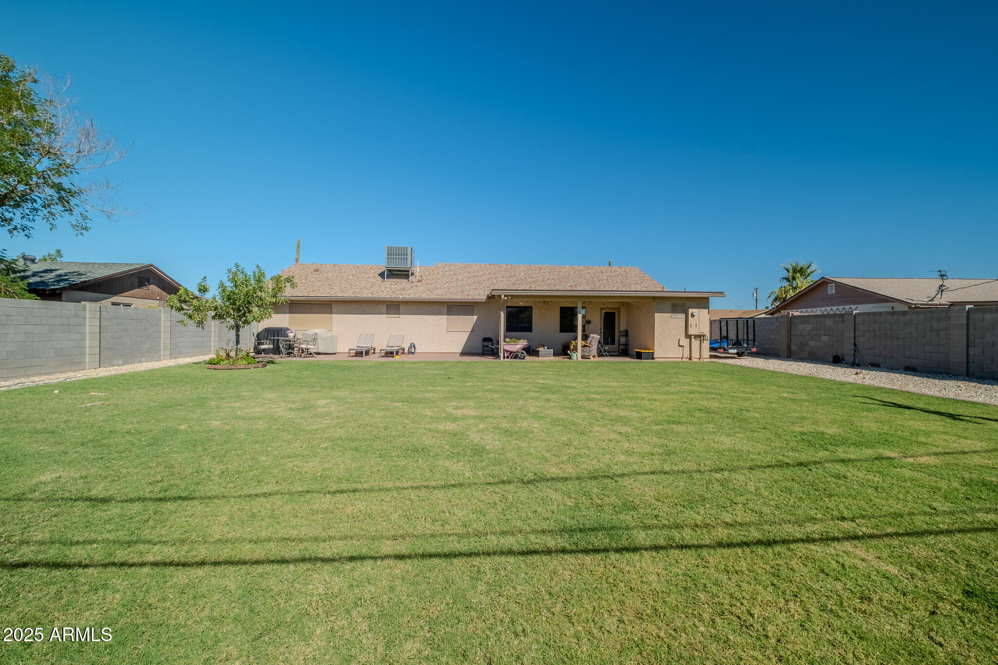 841 East Granada Avenue Apache Junction, AZ 85119 - Photo 10 of 33 a front view of a house with a yard